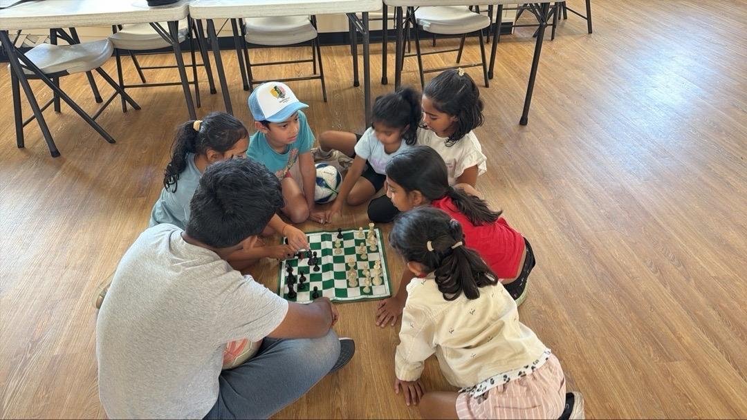 Kids learning chess strategy together